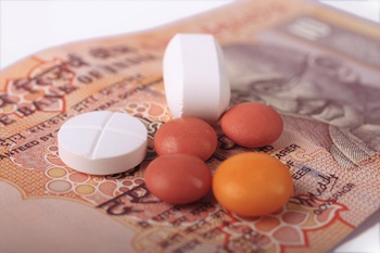 OTC drugs resting on top of Indian money