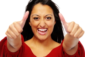Indian woman happily placing her thumbs in the air